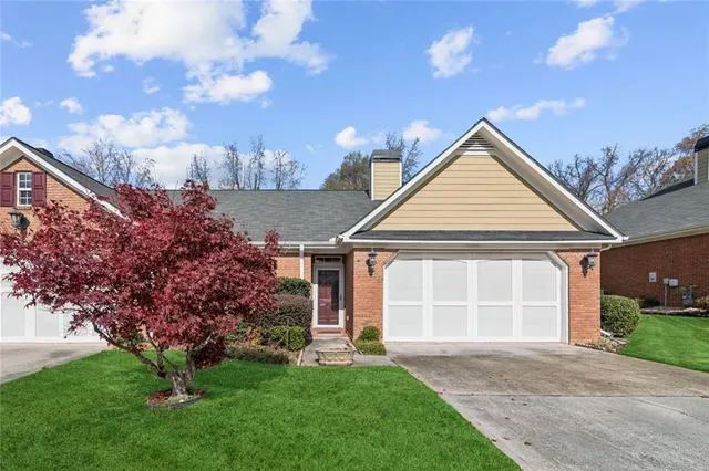 front view of a house with a yard