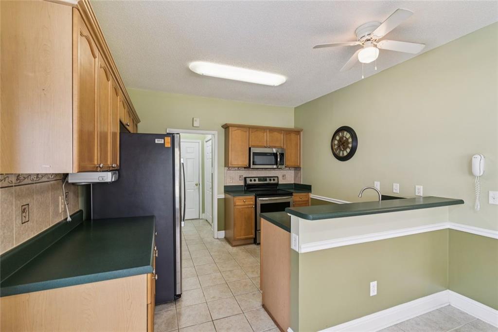 2530 Rosehill Circle Lithia Springs, GA 30122 - Photo 12 of 34 a kitchen with a sink appliances and cabinets