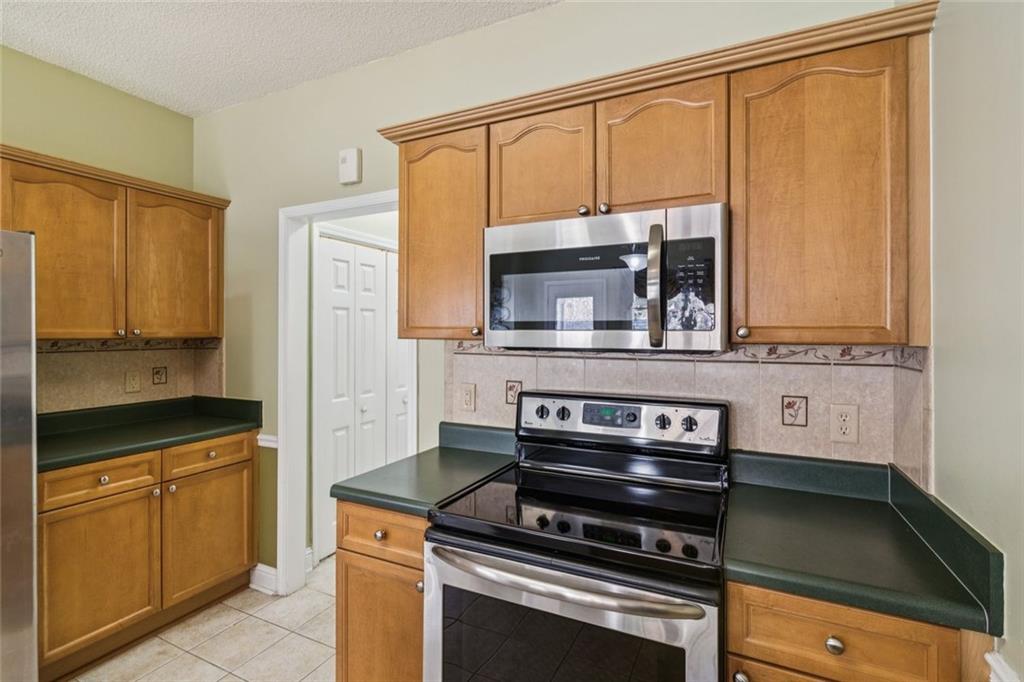 2530 Rosehill Circle Lithia Springs, GA 30122 - Photo 14 of 34 a kitchen with a stove and a microwave