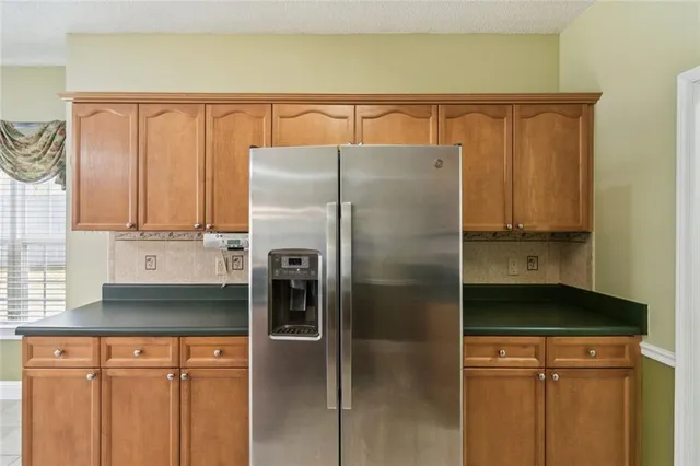 a view of a kitchen with a dishwasher cabinets and a kitchen counter top space