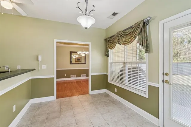 a bathroom with a double vanity sink toilet and shower