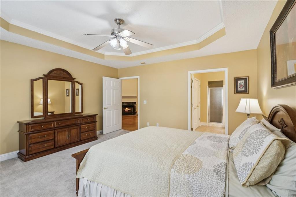 2530 Rosehill Circle Lithia Springs, GA 30122 - Photo 23 of 34 a bedroom with a bed and a dresser