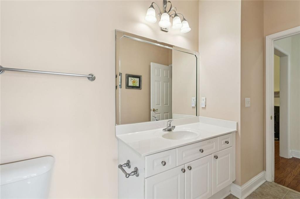 2530 Rosehill Circle Lithia Springs, GA 30122 - Photo 28 of 34 a bathroom with a sink vanity and a mirror