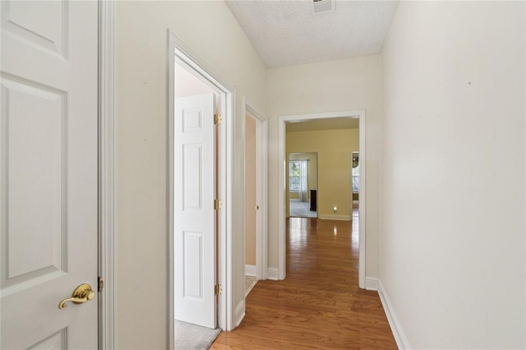 2530 Rosehill Circle Lithia Springs, GA 30122 - Photo 4 of 34 a view of a hallway with wooden floor