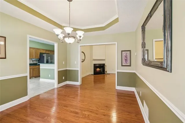 a kitchen with stainless steel appliances granite countertop a sink and a stove