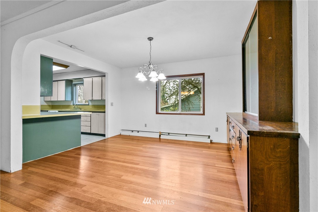 519 Quince Street Northeast Olympia, WA 98506 - Photo 11 of 39 a view of empty room with kitchen and window
