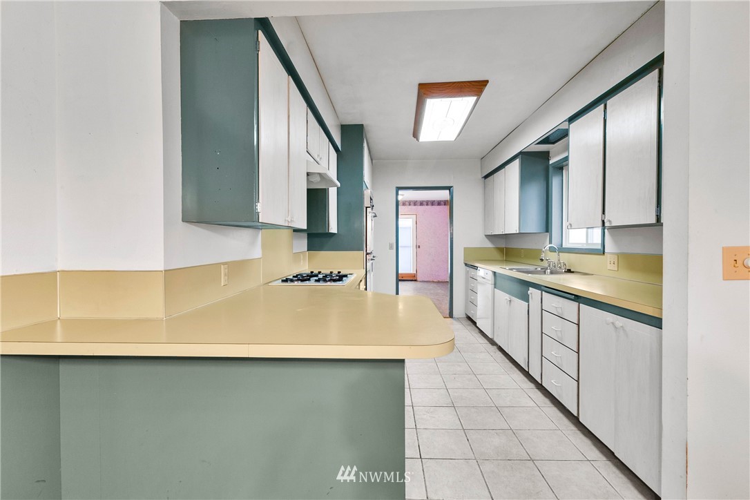 519 Quince Street Northeast Olympia, WA 98506 - Photo 12 of 39 a kitchen with counter top space and cabinets