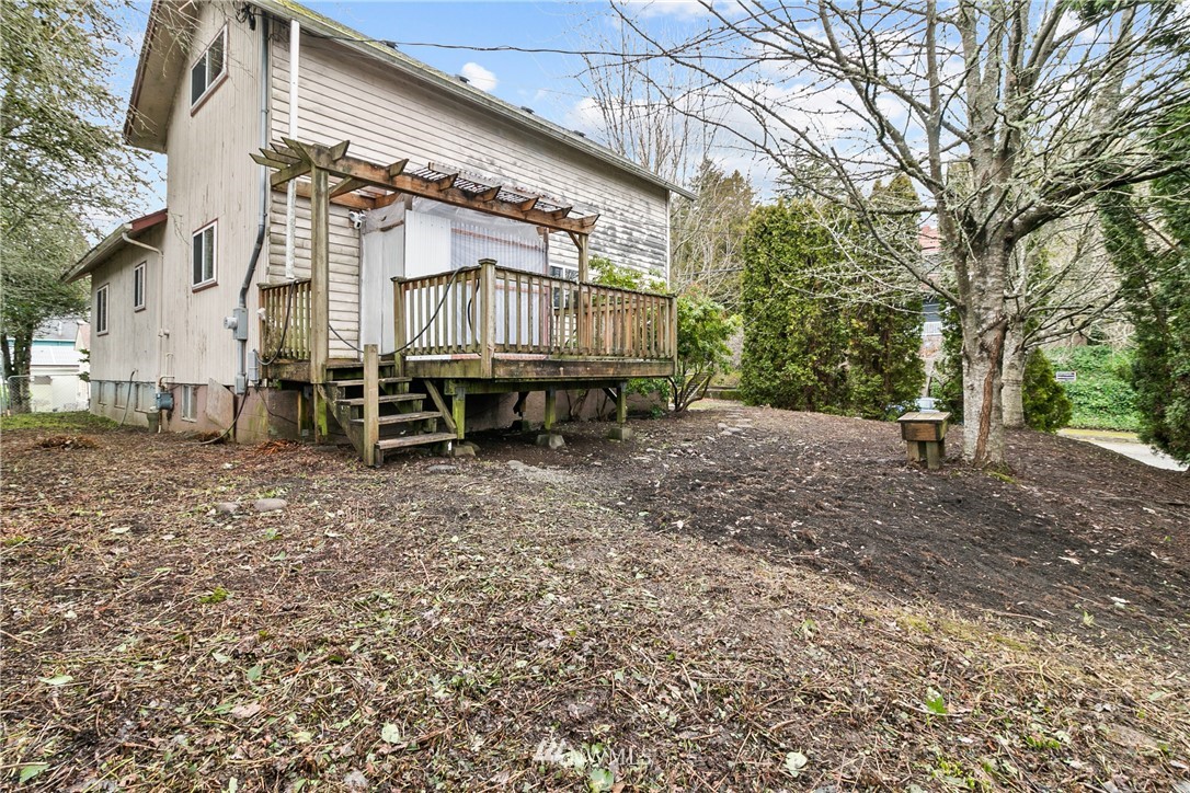 519 Quince Street Northeast Olympia, WA 98506 - Photo 32 of 39 a backyard of a house with barbeque oven table and chairs