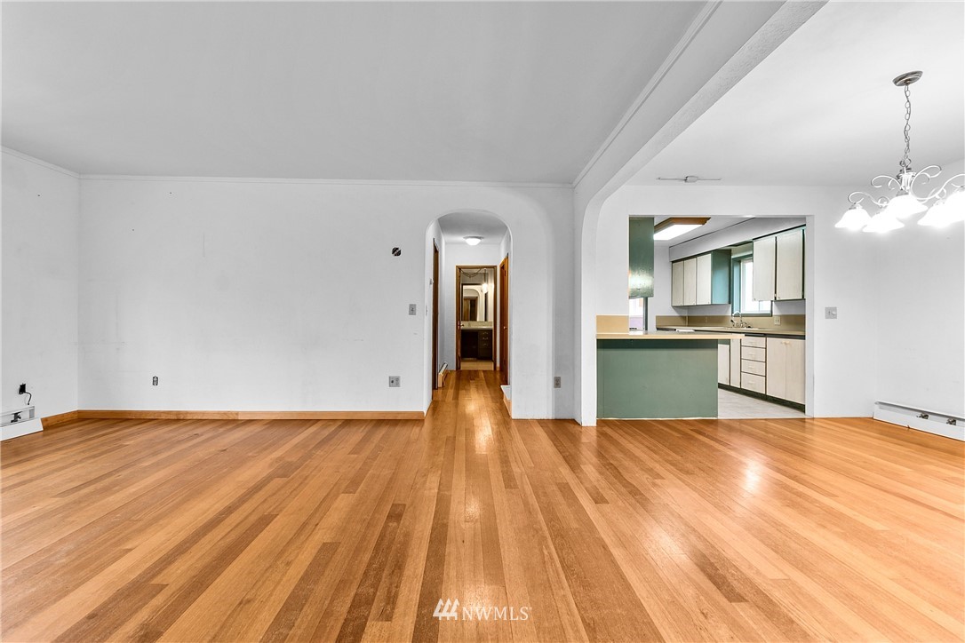 519 Quince Street Northeast Olympia, WA 98506 - Photo 7 of 39 a view of kitchen and hall with wooden floor