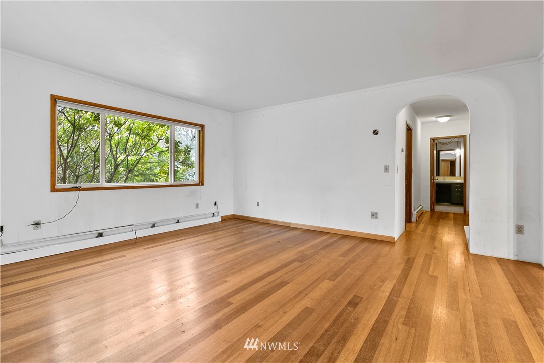 519 Quince Street Northeast Olympia, WA 98506 - Photo 9 of 39 a view of an empty room and wooden floor