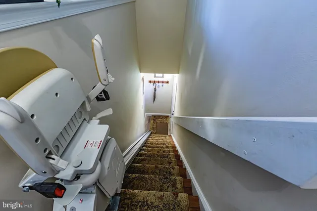 a kitchen with stainless steel appliances granite countertop a stove and a wooden floors