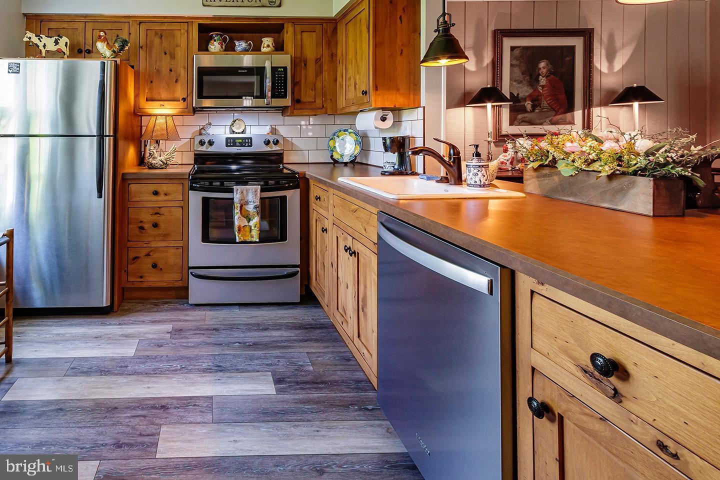 3408 B Neils Court Mount Laurel, NJ 08054 - Photo 4 of 9 a kitchen with stainless steel appliances granite countertop a refrigerator stove and sink