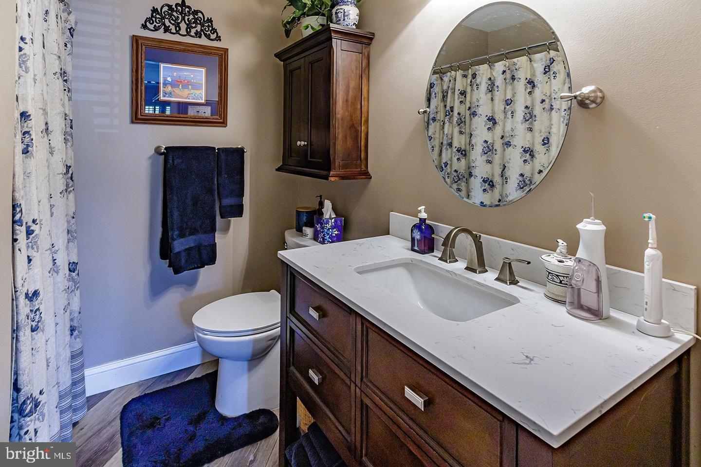 3408 B Neils Court Mount Laurel, NJ 08054 - Photo 6 of 9 a bathroom with a sink toilet and a mirror