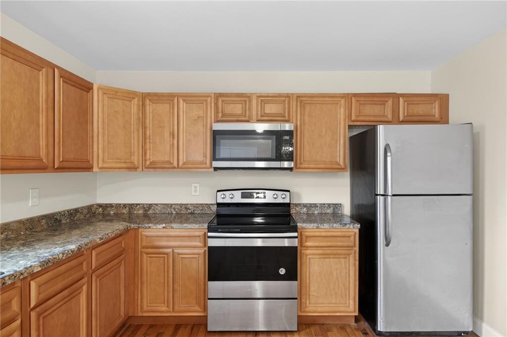 256 Astin Creek Road Villa Rica, GA 30180 - Photo 13 of 38 a kitchen with a refrigerator stove and microwave