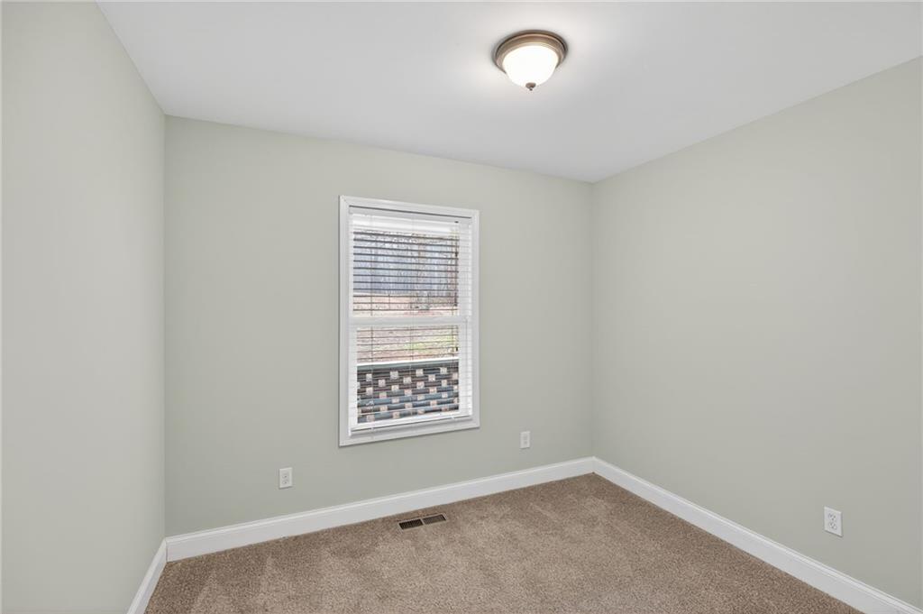 256 Astin Creek Road Villa Rica, GA 30180 - Photo 15 of 38 an empty room with windows