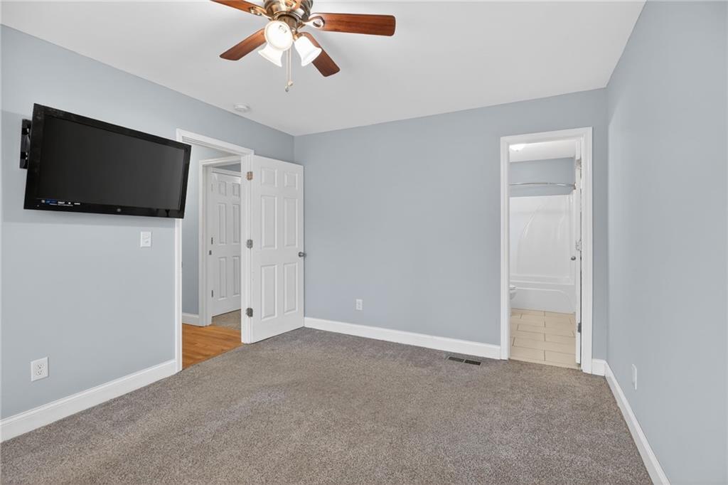 256 Astin Creek Road Villa Rica, GA 30180 - Photo 19 of 38 a view of a livingroom with a flat screen tv