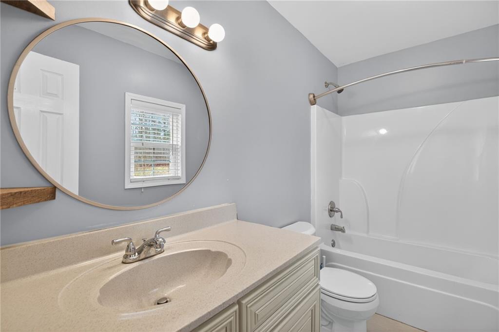 256 Astin Creek Road Villa Rica, GA 30180 - Photo 20 of 38 a bathroom with a sink a toilet and shower