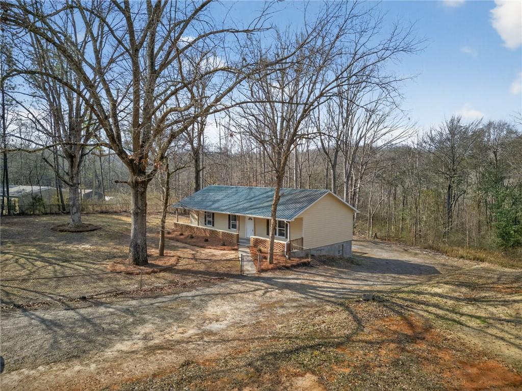 256 Astin Creek Road Villa Rica, GA 30180 - Photo 2 of 38 a view of a house with a yard covered in snow