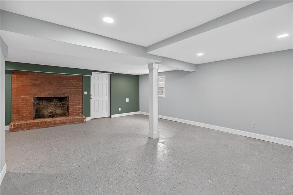 256 Astin Creek Road Villa Rica, GA 30180 - Photo 21 of 38 a view of empty room with a fireplace