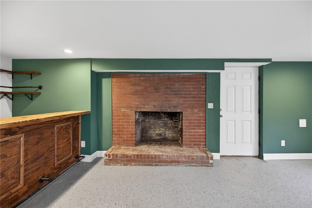 256 Astin Creek Road Villa Rica, GA 30180 - Photo 23 of 38 a living room with furniture and a fireplace