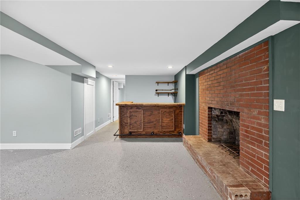 256 Astin Creek Road Villa Rica, GA 30180 - Photo 24 of 38 a living room with furniture and a fireplace