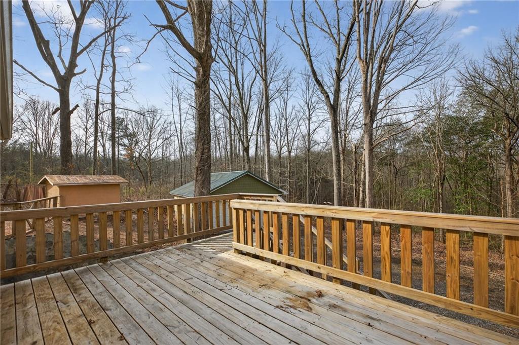 256 Astin Creek Road Villa Rica, GA 30180 - Photo 32 of 38 a view of deck with wooden floor and fence