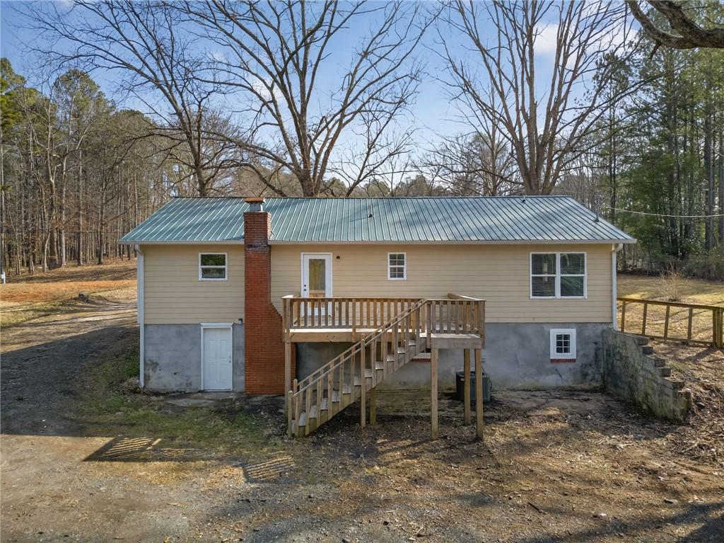 256 Astin Creek Road Villa Rica, GA 30180 - Photo 35 of 38 a view of a house with a yard and wooden fence