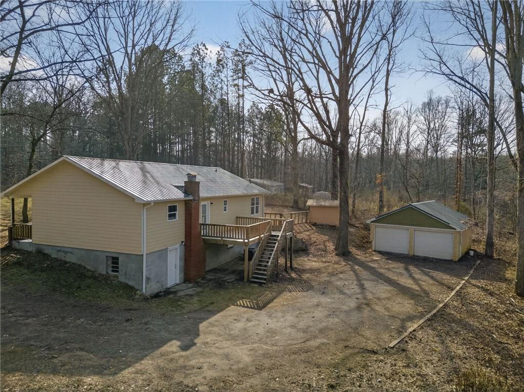 256 Astin Creek Road Villa Rica, GA 30180 - Photo 37 of 38 a view of a house with a yard and sitting area