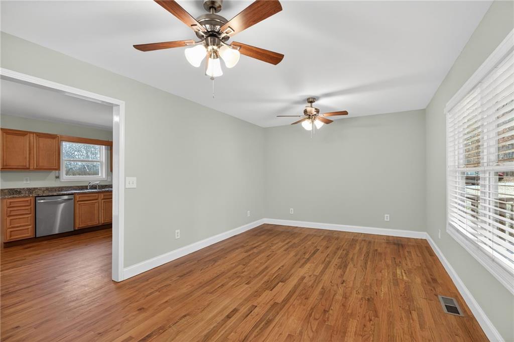 256 Astin Creek Road Villa Rica, GA 30180 - Photo 7 of 38 wooden floor in an empty room with a window