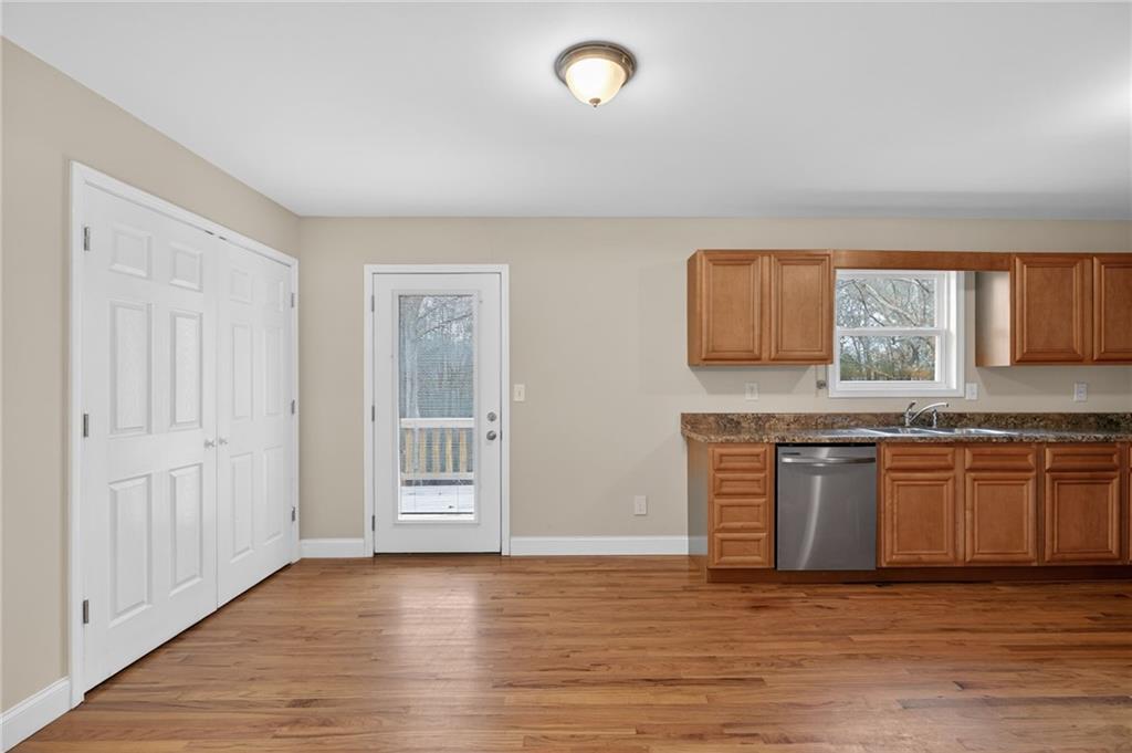 256 Astin Creek Road Villa Rica, GA 30180 - Photo 8 of 38 a view of a kitchen with granite countertop stainless steel appliances stove and sink
