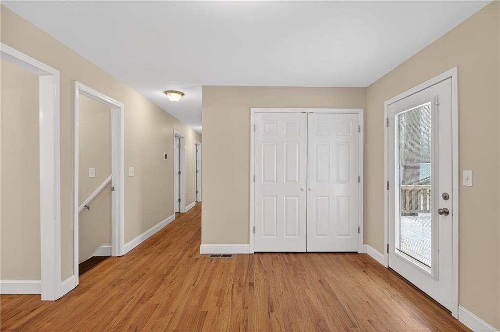 256 Astin Creek Road Villa Rica, GA 30180 - Photo 9 of 38 a view of a hallway with wooden floor