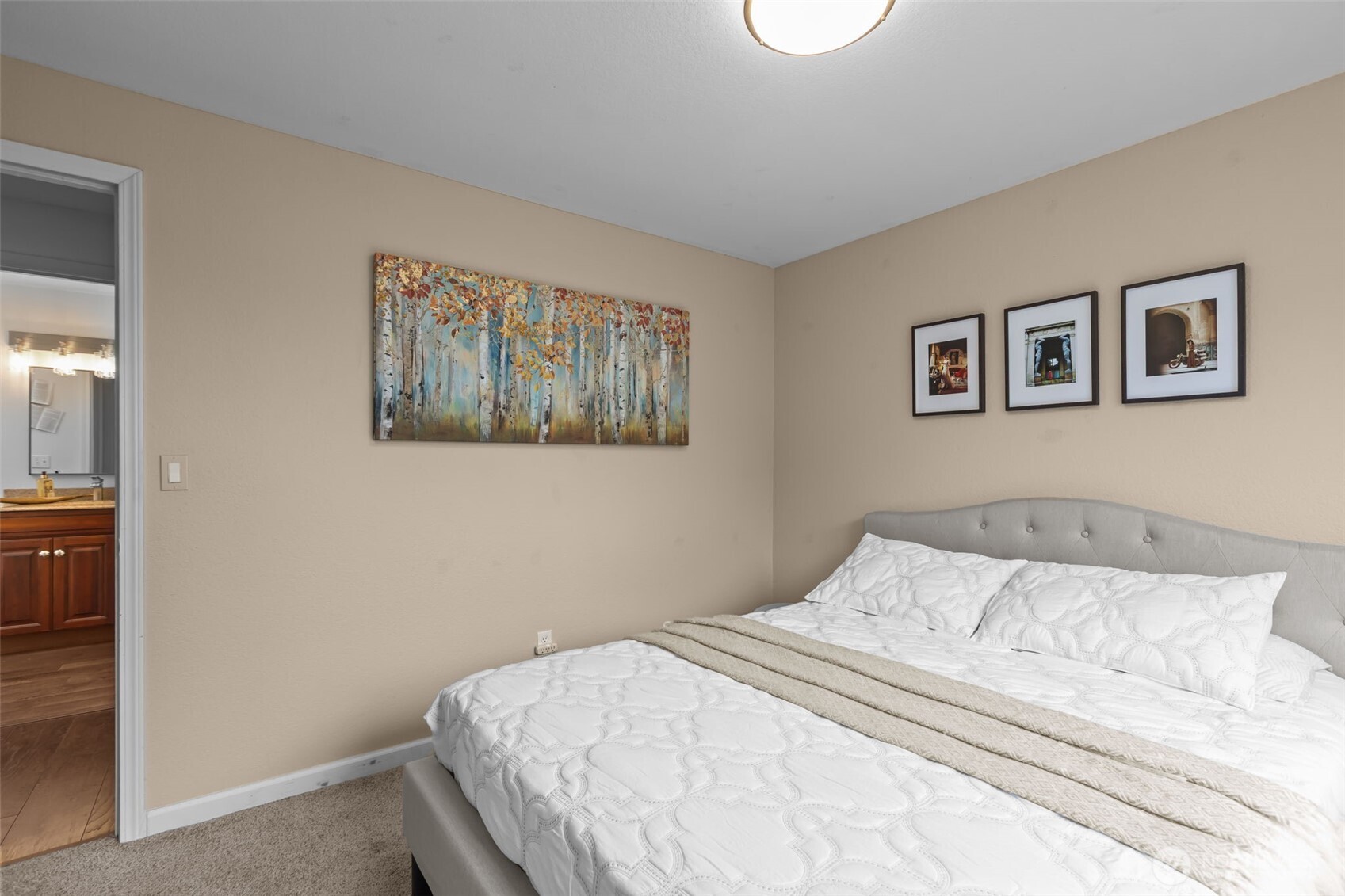 1073 Southwest 326th Street Federal Way, WA 98023 - Photo 11 of 31 a bedroom with a bed and a painting on the wall