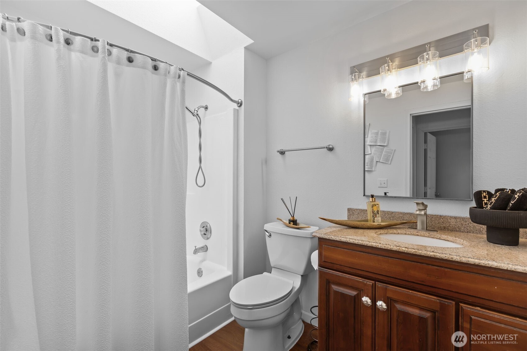 1073 Southwest 326th Street Federal Way, WA 98023 - Photo 12 of 31 a bathroom with a granite countertop sink toilet and shower