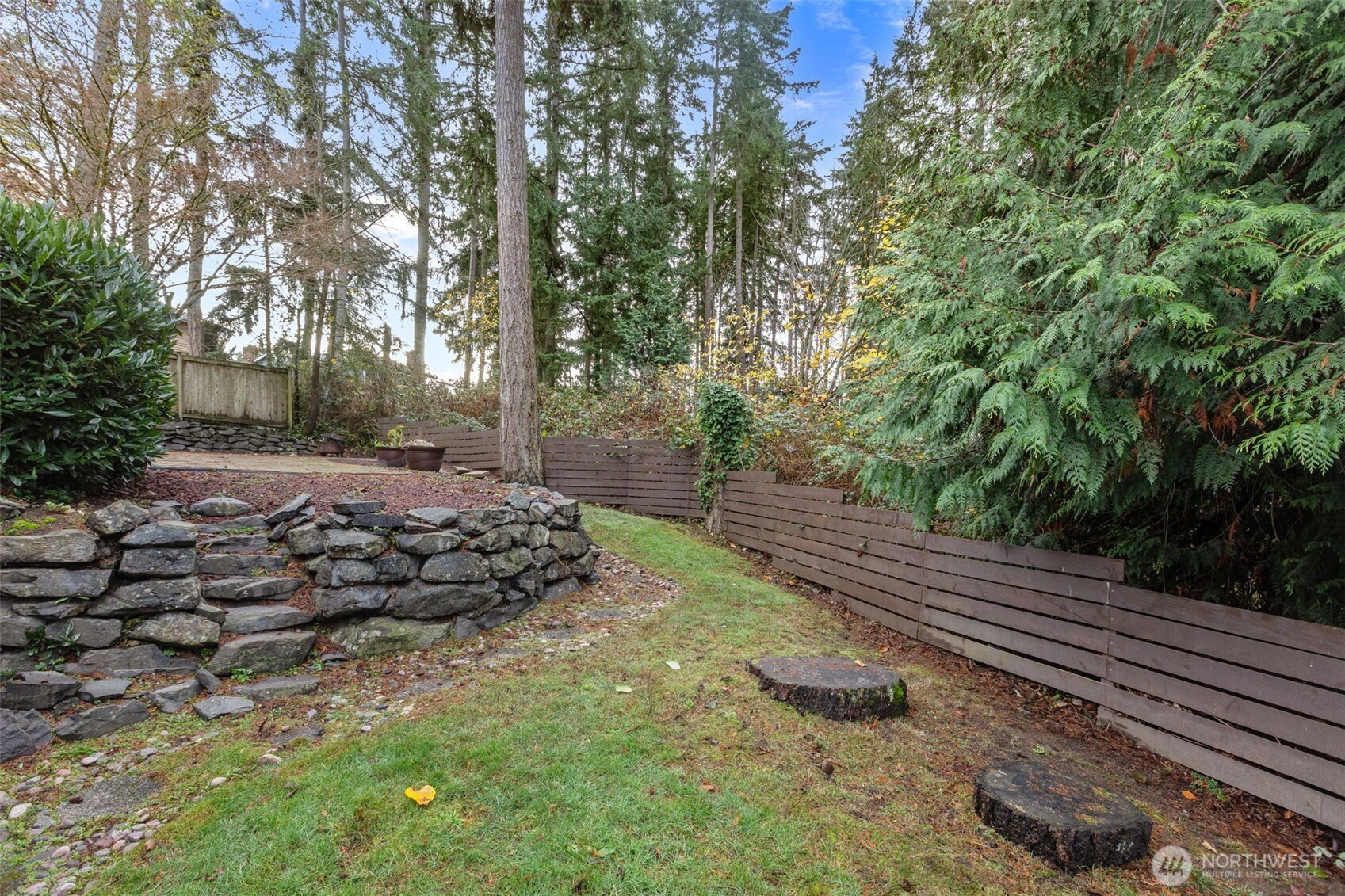 1073 Southwest 326th Street Federal Way, WA 98023 - Photo 25 of 31 a view of a backyard with trees