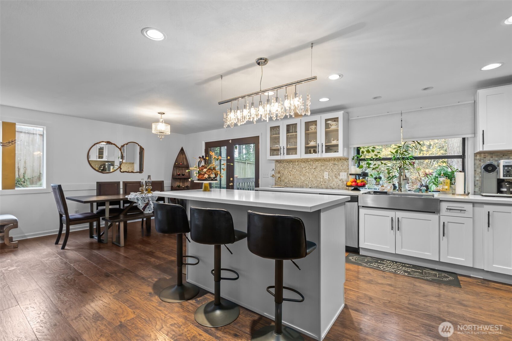 1073 Southwest 326th Street Federal Way, WA 98023 - Photo 4 of 31 a kitchen with center island table and chairs in it