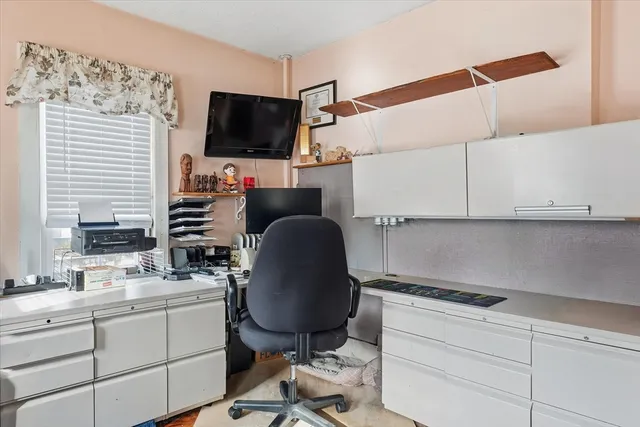 a room with cabinets and flat screen tv