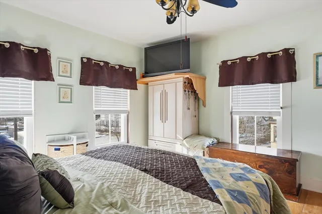 a bedroom with a bed and dresser