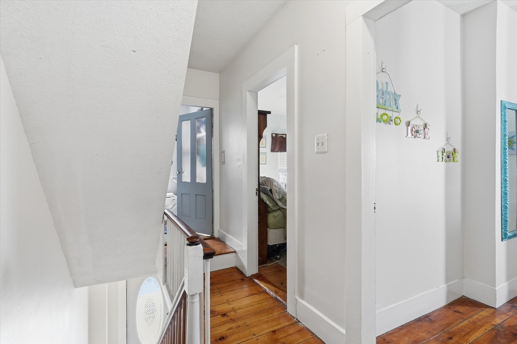 30-32 Walnut Street Maynard, MA 01754 - Photo 16 of 38 a view of an entryway with wooden floor