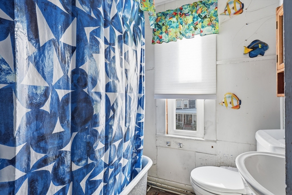 30-32 Walnut Street Maynard, MA 01754 - Photo 17 of 38 a bathroom with a sink toilet and window
