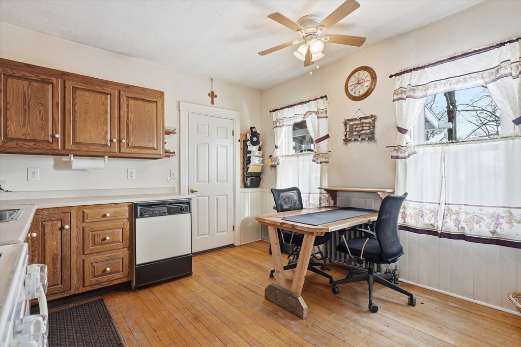 30-32 Walnut Street Maynard, MA 01754 - Photo 19 of 38 a view of a dining room with furniture and wooden floor