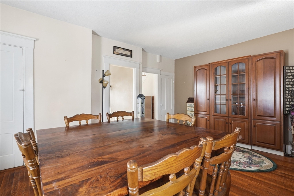 30-32 Walnut Street Maynard, MA 01754 - Photo 23 of 38 a dining room with furniture and wooden floor