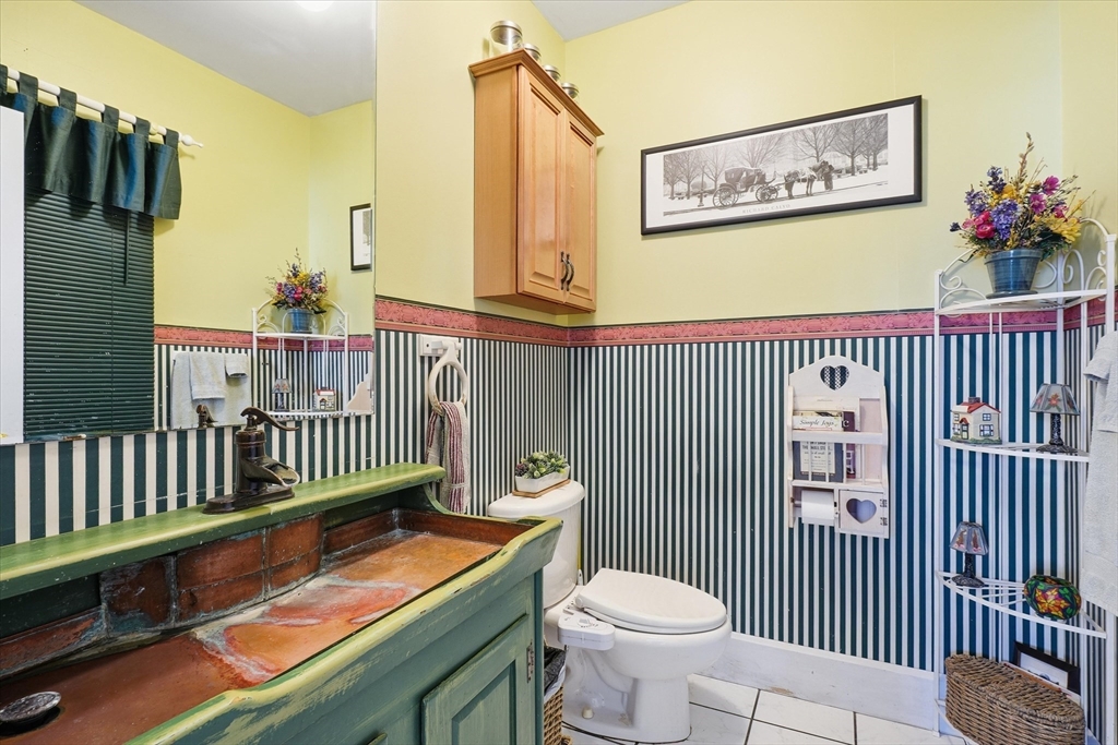 30-32 Walnut Street Maynard, MA 01754 - Photo 6 of 38 a view of a porch with furniture