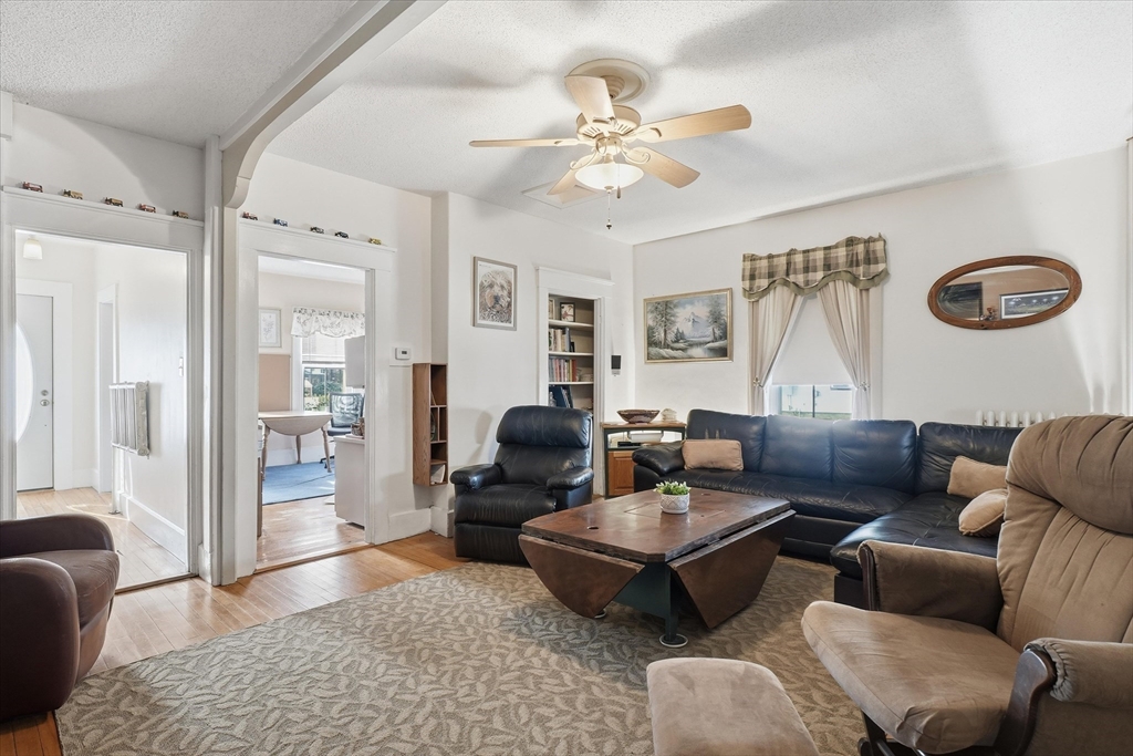 30-32 Walnut Street Maynard, MA 01754 - Photo 7 of 38 a living room with furniture and wooden floor