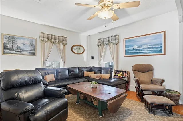 a living room with furniture and a rug