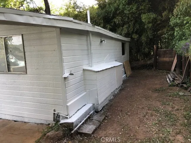 a view of backyard and entertaining space