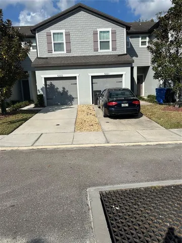 a view of a car parked in front of house