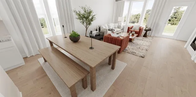 a view of a livingroom with workspace and a window