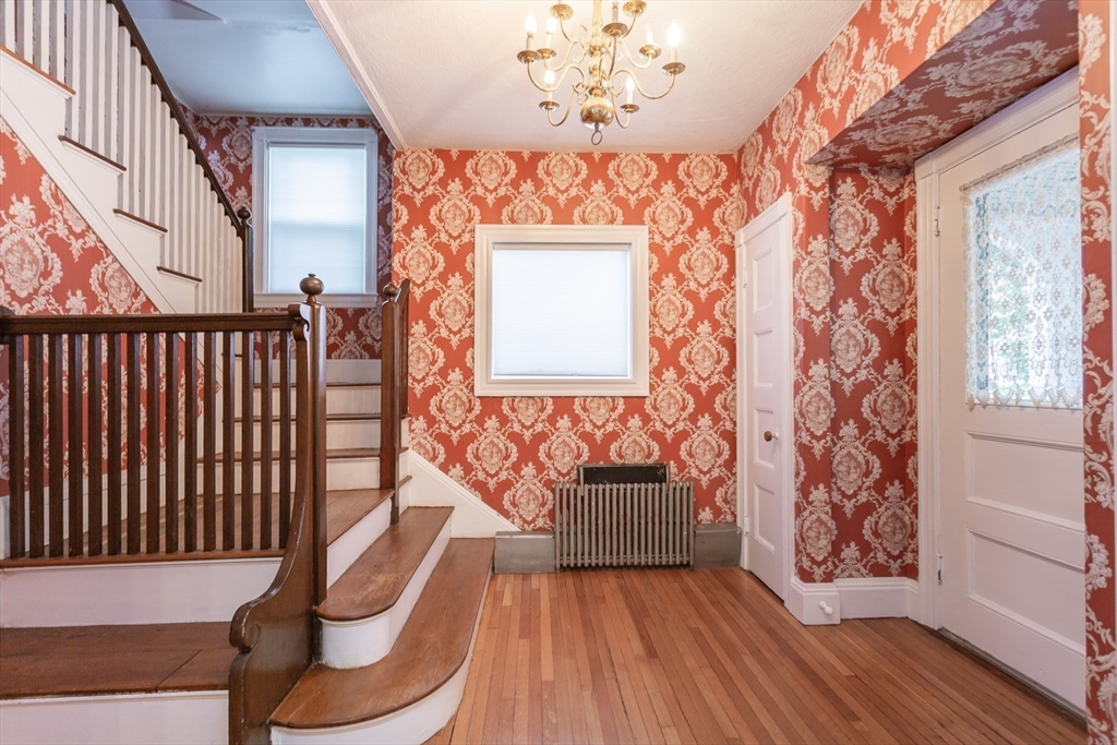 724 High Street Fall River, MA 02720 - Photo 6 of 39 a view of a room with wooden floor and windows