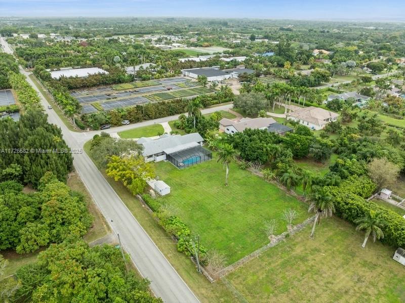 16150 Southwest 252nd Street Homestead, FL 33031 - Photo 54 of 54 an aerial view of residential houses with outdoor space and trees