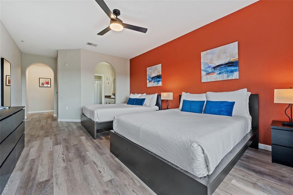 14200 Avalon Road, Unit 409 Winter Garden, FL 34787 - Photo 23 of 33 a spacious bedroom with a bed and a table